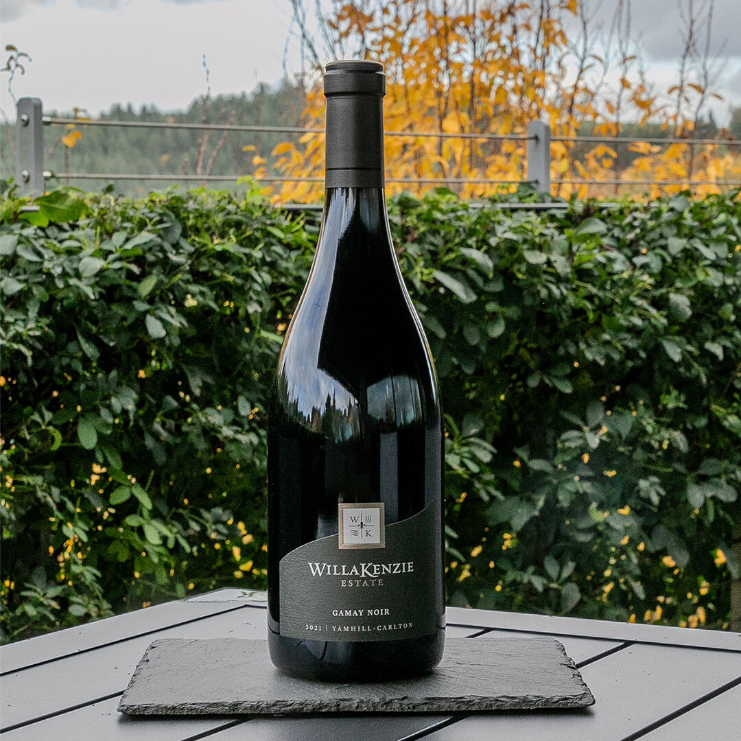 Bottle of Gamay Noir outside WillaKenzie Estate